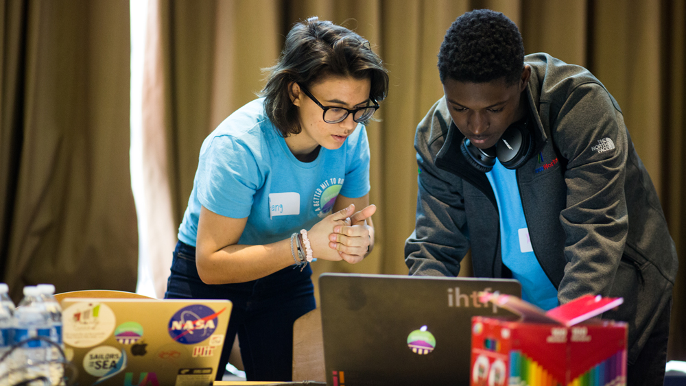 two students working together at a computing event